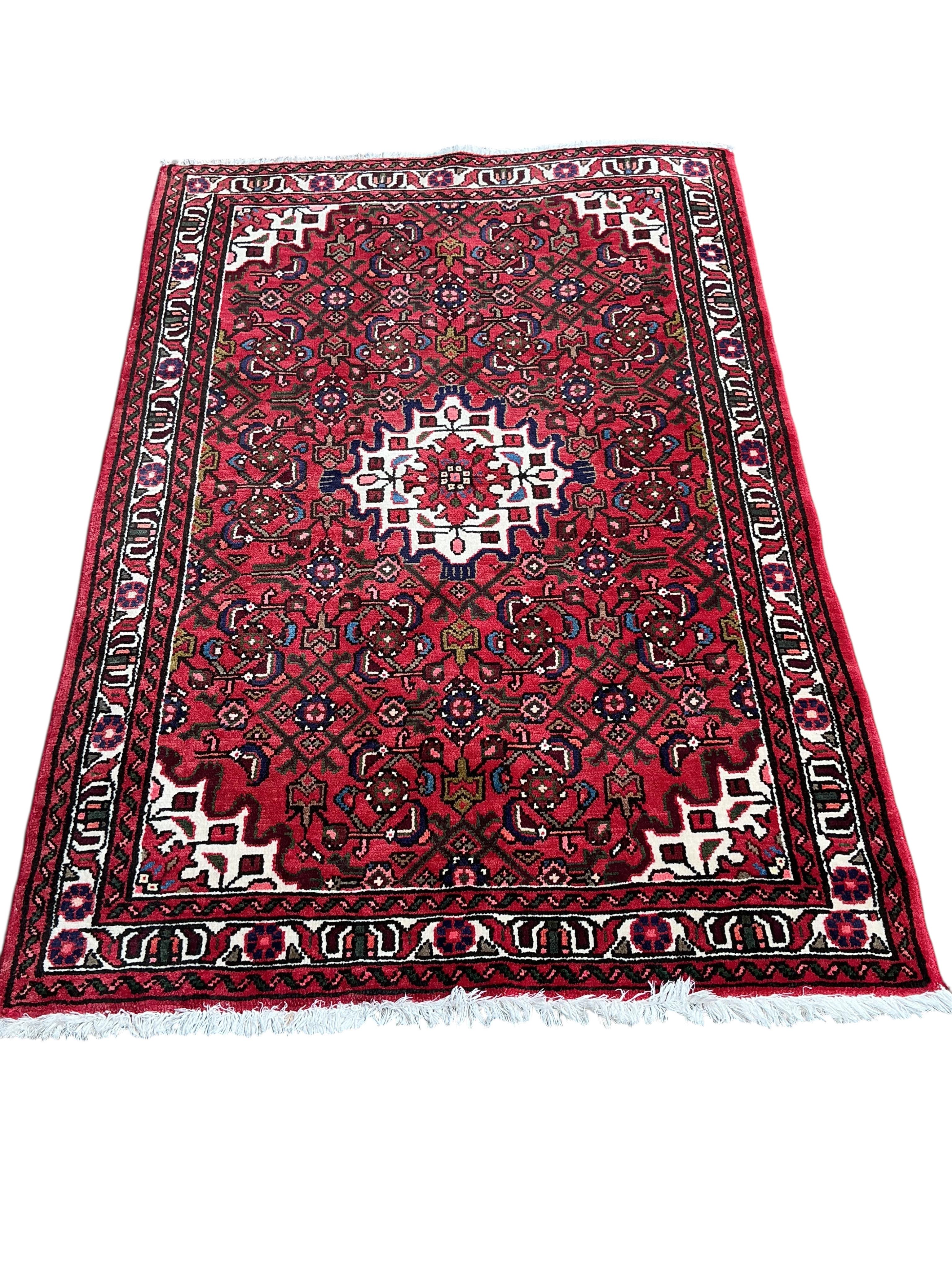 A Hamadan red ground rug, 160 x 110cm